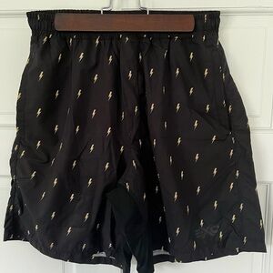 EXO Black Athletic Shorts with Gold Lightning Pattern